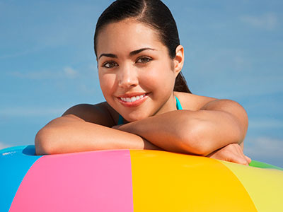 girl laying on beachball