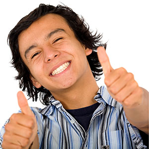 smiling young man giving thumbs up